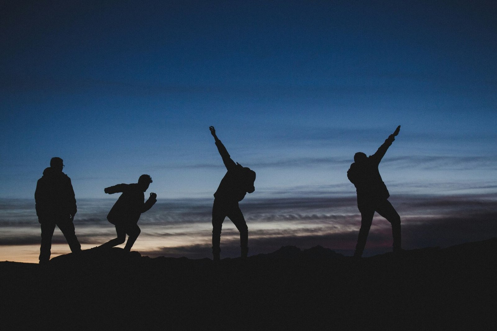 Friends celebrating a shared journey at dusk